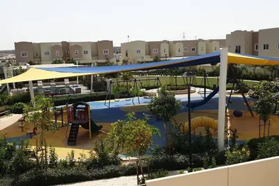 a park with a playground with a slide at Elite Inn: Amaranta75 (Townhouse Direct pool view) in Dubai