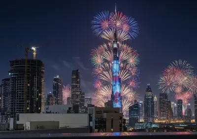 a view of a city with fireworks in the sky at Ultimate Stay / 4 Beds / Burj Khalifa View / Ultra Modern / Business Bay in Dubai