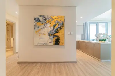 a white room with a painting on a wall at FIRST CLASS 2BR with full DUBAI BOULEVARD view in Dubai