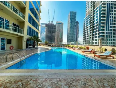a swimming pool with a view of the city at HomesGetaway -Fanciful 1BR Apartment in JLT Lake View in Dubai
