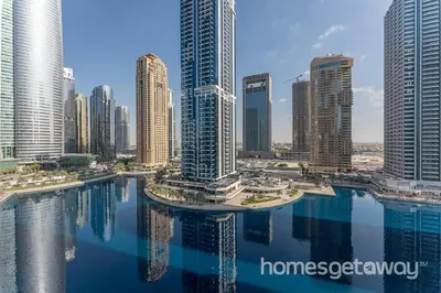 a view of a city with tall buildings and water at HomesGetaway -Fanciful 1BR Apartment in JLT Lake View in Dubai