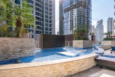 a pool in the middle of a city with buildings at Veer Apartments - 82nd Floor Princess Tower - Palm View in Dubai