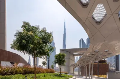 a view of a city from a building with trees at Frank Porter - Index Tower in Dubai