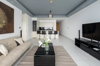 a living room with a couch and a table at Frank Porter - Index Tower in Dubai