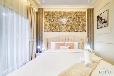 a bedroom with a bed and a large window at Ornate 2BR at Diamond Views 1, Jumeirah Village Circle by Deluxe Holiday Homes in Dubai