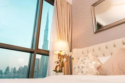 a bedroom with a view of the burj khalifa at Elite Royal Apartment - Panoramic Full Burj Khalifa, Fountain & Skyline View - ACed direct connection to Dubai Mall - Governor in Dubai