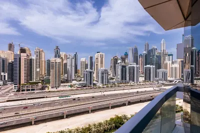 a view of a large city with a highway at 180° Sheik Zayed Road balcony views 2BR in JLT in Dubai