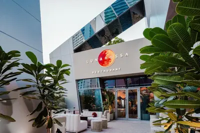 a facade of a building with a restaurant at Lusso Hometels J One Business Bay in Dubai