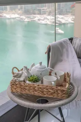 a basket with teaiments on a table in front of a window at Frank Porter - The Point in Dubai
