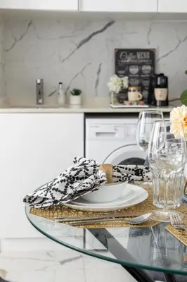 a glass table with a plate on top of it at Frank Porter - The Point in Dubai