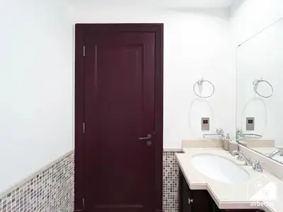 a bathroom with a black door and a sink at Luxury 2Bedroom in Dubai Old Town with Burj View in Dubai