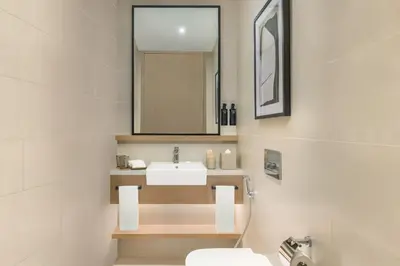 a bathroom with a sink and a mirror at Vida Dubai Marina & Yacht Club in Dubai