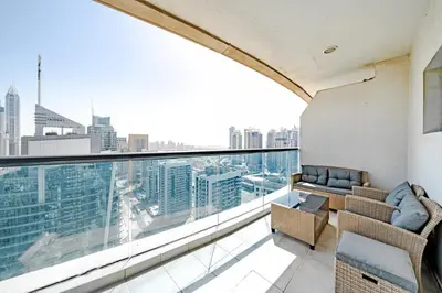 a balcony with a view of a city skyline at Spacious 3BR with 180˚ Dubai Marina Views in Dubai