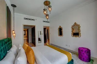 a bedroom with a large white bed in a room at Durrani Homes - Heaven on Earth in Dubai