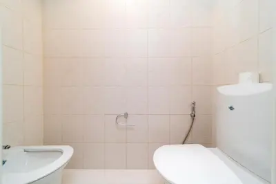a bathroom with a toilet and a sink at Elan Suites 5-Bedroom Beach Villa in Dubai