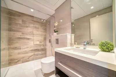 a bathroom with a sink and a toilet and a shower at Studio with City Views, Jumeirah Lake Towers - Mint Stay in Dubai