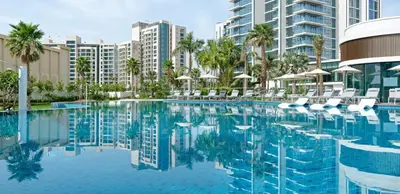 a swimming pool with chairs and buildings in the background at Studio with City Views, Jumeirah Lake Towers - Mint Stay in Dubai