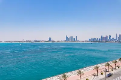 a view of the dubai city skyline from the beach at GlobalStay Azizi Mina Beachfront Apartments Palm Jumeirah in Dubai