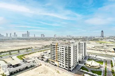 an aerial view of a city with tall buildings at Prime 1BR at Binghatti Avenue Al Jaddaf by Deluxe Holiday Homes in Dubai