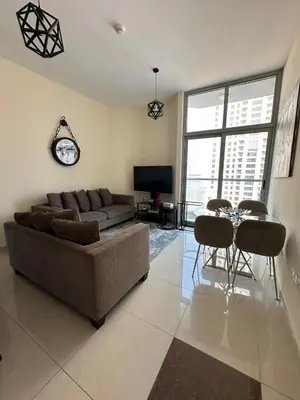 a living room with a couch and a table with chairs at Dubai Marina Royal Premium Serviced Apartments Marina Wharf - KIDS STAY FREE plus free check in 24 hours in Dubai