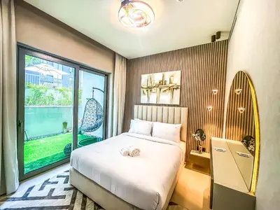 a bedroom with a bed and a large window at STAY BY LATINEM Luxury 1BR Holiday Home CV A107 near Burj Khalifa in Dubai