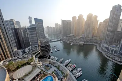 a view of a city with boats in a river at Marina Canal Views Next to Mall & Marina Promenade Studio Unit, The Address Residences, Dubai Marina by Deluxe Holiday Homes in Dubai