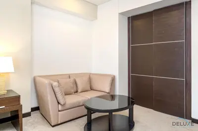 a living room with a couch and a table at Marina Canal Views from the Balcony, Close to Marina Mall, The Address Residences, Dubai Marina by Deluxe Holiday Homes in Dubai