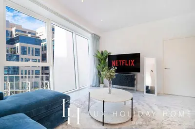 a living room with a couch and a table at LUX The Pad Executive Suite Canal View 4 in Dubai
