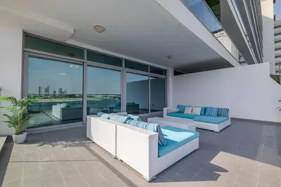 a patio with two couches and views of the city at 2BDR apartment with full sea view and Dubai Marina view Azure Residences in Dubai
