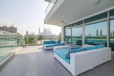 a balcony with couches and a view of the city at 2BDR apartment with full sea view and Dubai Marina view Azure Residences in Dubai