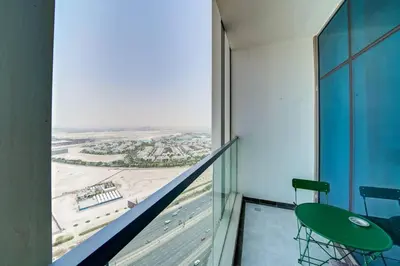 a balcony with a view of a city from a building at Lovely studio in Business Bay in Dubai