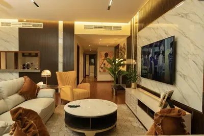 a living room with a couch and a table at Luxury 3 BR - Direct View to Burj Khalifa in Dubai