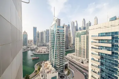 a view of a city with a river and buildings at 1BDR Apartment in Dubai Marina with Marina Views in Dubai
