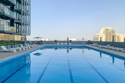 a large swimming pool on top of a building at Frank Porter - Bloom Tower A in Dubai