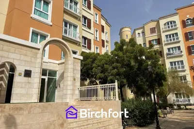 a sign in front of a building with buildings at Birchfort - Newly renovated unique 1 bedroom apartment in Dubai
