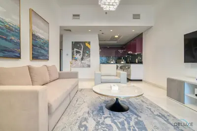 a living room with a couch and a table at Sea Views from Living to Bedroom Perfect for Staycation, Dubai Marina by Deluxe Holiday Homes in Dubai
