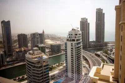 an aerial view of a city with tall buildings at La Buena Vida Holiday Homes - Beach front very spacious, luxe and modern 3 bedroom with full kitchen in JBR , 3 min to the JBR beach Dubai Marina and Tram Station in Dubai