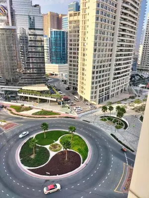 an intersection in a city with cars on a road at Amazing apartment 2 bed rooms in Tecom 6 pax in Dubai