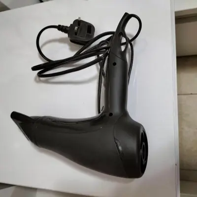 a black object sitting on a white table at Amazing apartment 2 bed rooms in Tecom 6 pax in Dubai