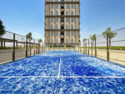 a tennis court in front of a building at GuestReady - Breath of Fresh Air in Dubai Hills in Dubai