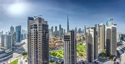 an aerial view of a city with tall buildings at Amazing Burj Khalifa view from Brand new apartment in Dubai