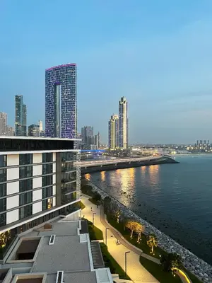 a view of a city with a river and buildings at Livbnb-Upgraded 2BR plus Maid's Room with Sea View in Dubai