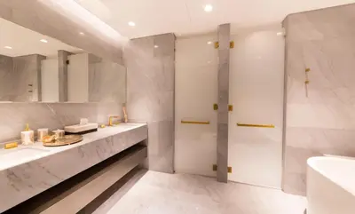 a bathroom with two sinks and a shower at Maison Privee - Luxury Sea View Apt in FIVE Resort on The Palm in Dubai