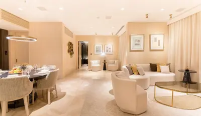a living room with a couch and a table at Maison Privee - Luxury Sea View Apt in FIVE Resort on The Palm in Dubai