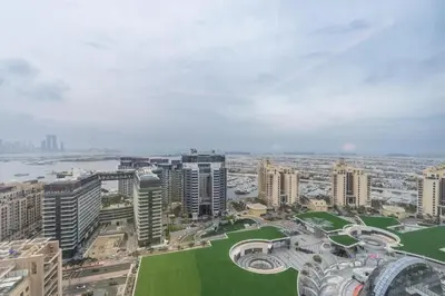an aerial view of a city with tall buildings at Palm Tower where Luxury & View meet in one place in Dubai