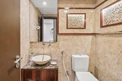 a bathroom with a toilet and a sink at The Lofts - Luxurious space with Burj Khalifa View in Dubai