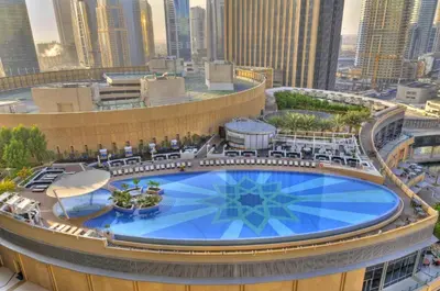a large swimming pool on top of a building at Graceful 1BR at The Address Residences Dubai Marina by Deluxe Holiday Homes in Dubai