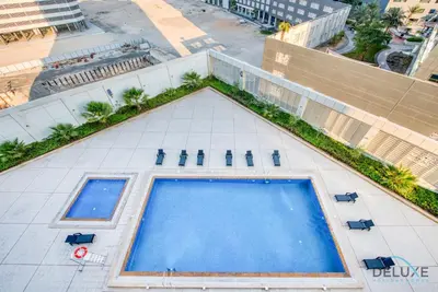 an overhead view of a swimming pool on a building at Pleasant Studio at Safir Tower 1 Business Bay by Deluxe Holiday Homes in Dubai