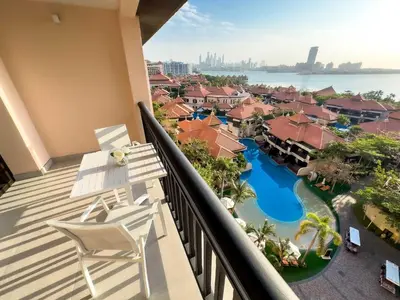 a balcony with a view of a resort at Fabulous 1 bedroom apartment at 5 Star Resort in Dubai