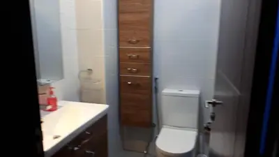 a bathroom with a white toilet and a sink at DUBAI - Glitz 3 Residences - MAJESTIC Luxe Holiday Home - 2BR - Sleep 4 - FOR FAMILIES & COUPLES STAYS ONLY in Dubai